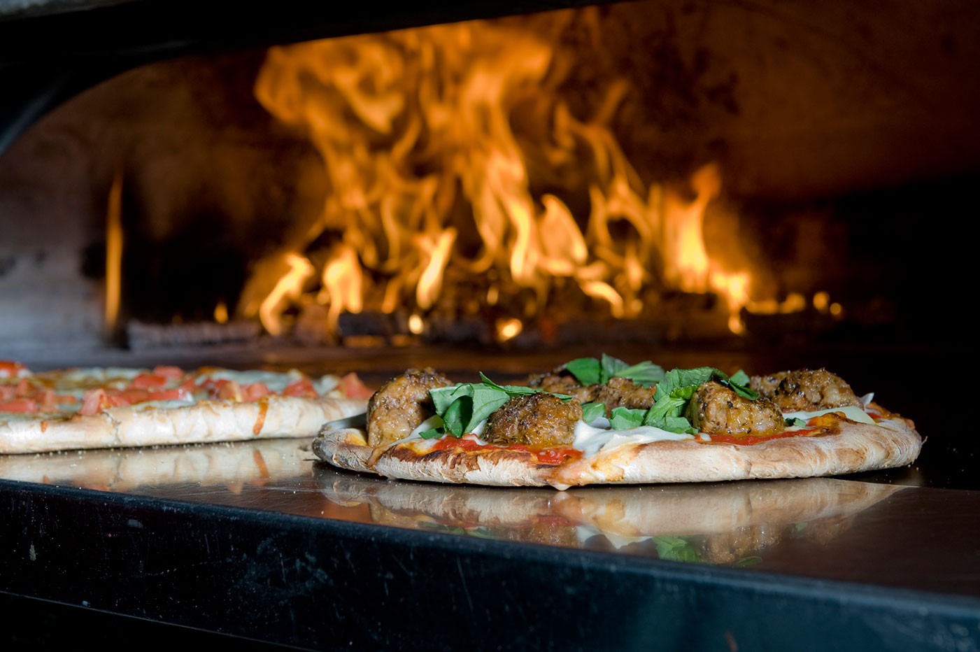 Wood-fired pizza and brewing imagery